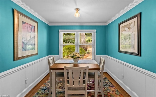 1608 Fox Hollow Rd, Greensboro, NC 27410 - dining room with wood finished floors, wainscoting, and ornamental molding