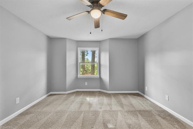 unfurnished room with baseboards and carpet