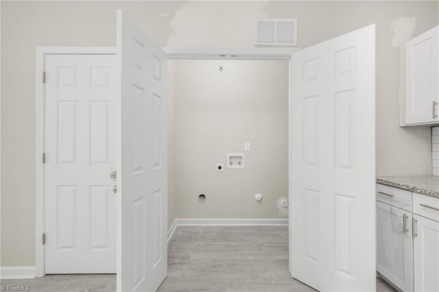clothes washing area featuring laundry area, hookup for an electric dryer, visible vents, hookup for a washing machine, and light wood-style floors