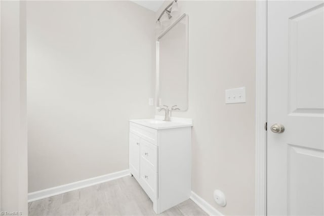 bathroom with baseboards and vanity