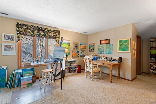 carpeted office with visible vents, baseboards, and a textured ceiling