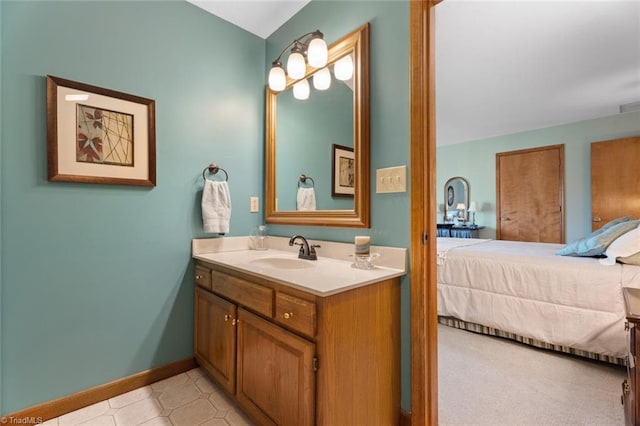 bathroom featuring vanity, visible vents, baseboards, and connected bathroom