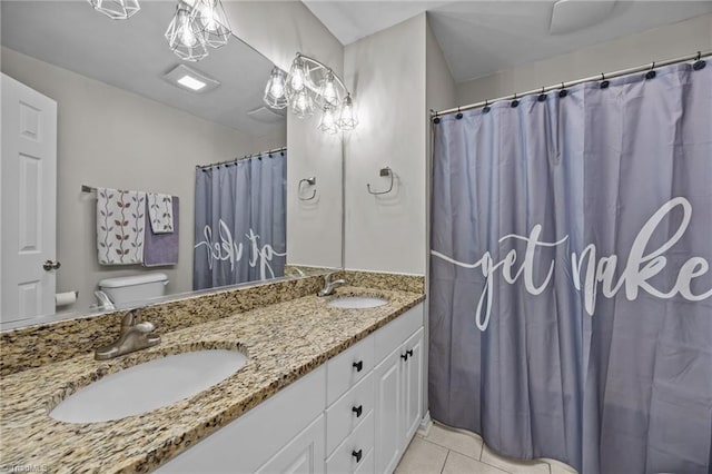 6089 Pleasant Field Dr, Greensboro, NC 27455 - full bathroom featuring toilet, double vanity, tile patterned floors, and a shower with shower curtain