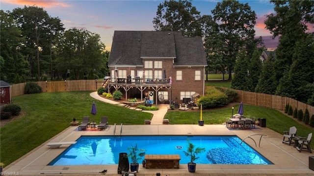 6089 Pleasant Field Dr, Greensboro, NC 27455 - rear view of property featuring a patio area, brick siding, and a wooden deck