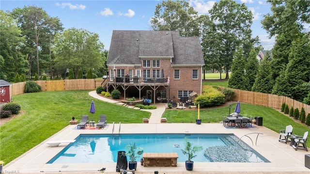 6089 Pleasant Field Dr, Greensboro, NC 27455 - back of property with a patio, brick siding, and a wooden deck