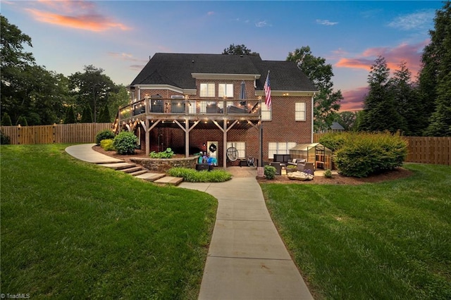 6089 Pleasant Field Dr, Greensboro, NC 27455 - back of property with a wooden deck and a patio area