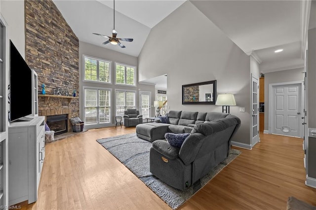 6089 Pleasant Field Dr, Greensboro, NC 27455 - living area with a ceiling fan, a fireplace, light wood finished floors, and high vaulted ceiling