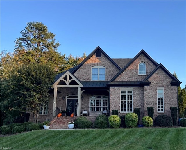 view of front of home with a front lawn and a porch