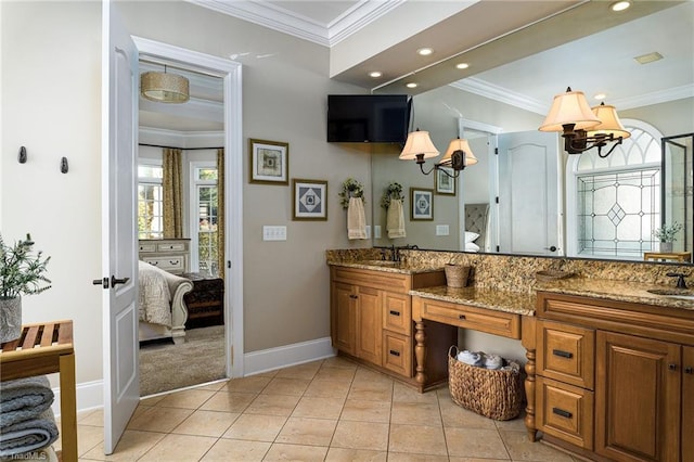 bathroom featuring vanity, crown molding, a chandelier, and tile patterned floors