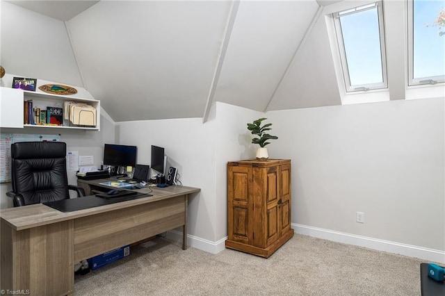 carpeted office with vaulted ceiling