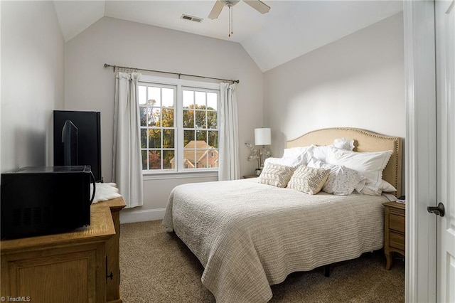 carpeted bedroom with vaulted ceiling and ceiling fan