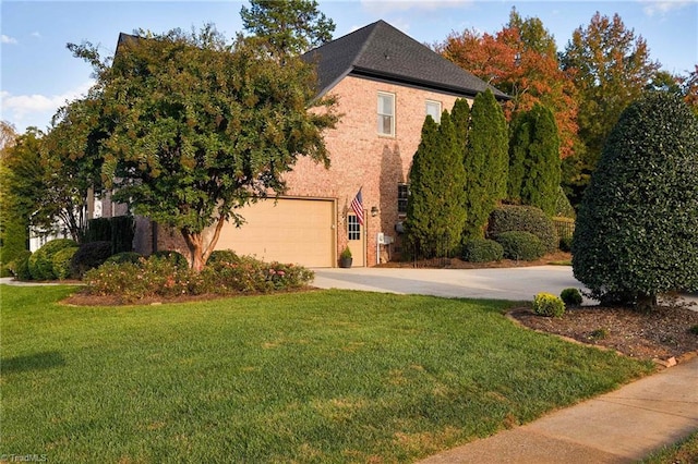 view of front of home with a front yard and a garage