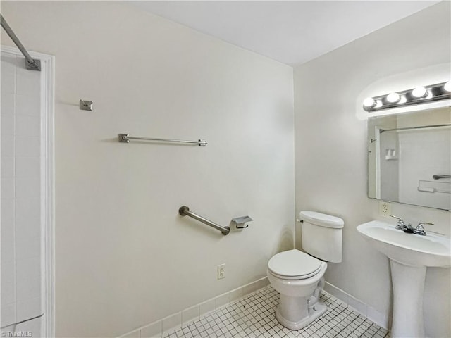 full bath with toilet, tile patterned flooring, baseboards, and a shower