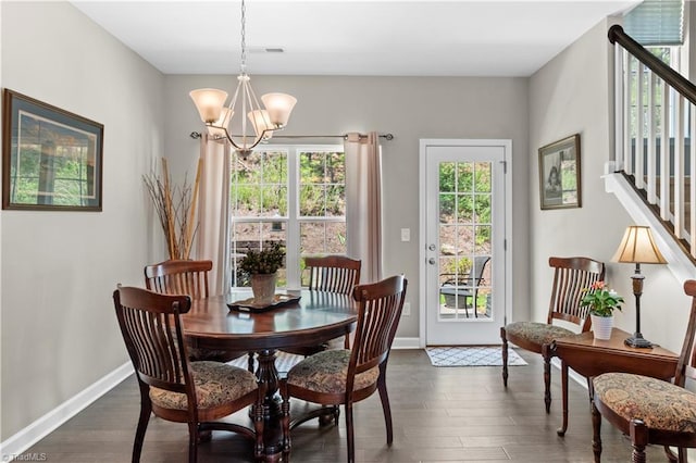 211 Hawks Nest Cir, Clemmons, NC 27012 - dining room featuring stairway, dark wood-style flooring, and a chandelier