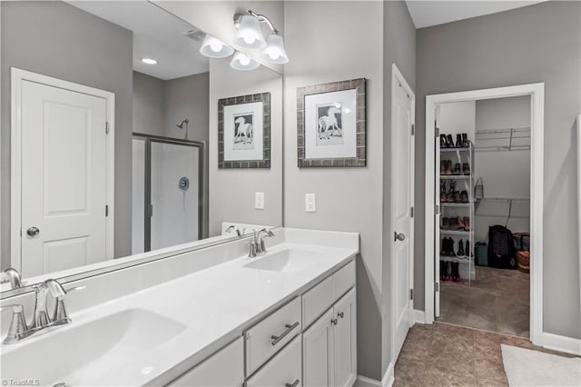 211 Hawks Nest Cir, Clemmons, NC 27012 - full bath featuring a shower stall, double vanity, and a walk in closet