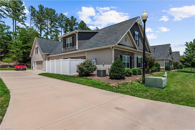 211 Hawks Nest Cir, Clemmons, NC 27012 - view of home's exterior featuring driveway and roof with shingles