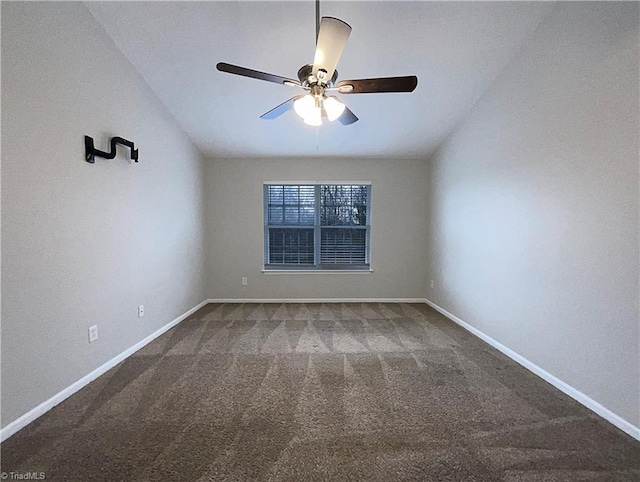 empty room with carpet, a ceiling fan, and baseboards