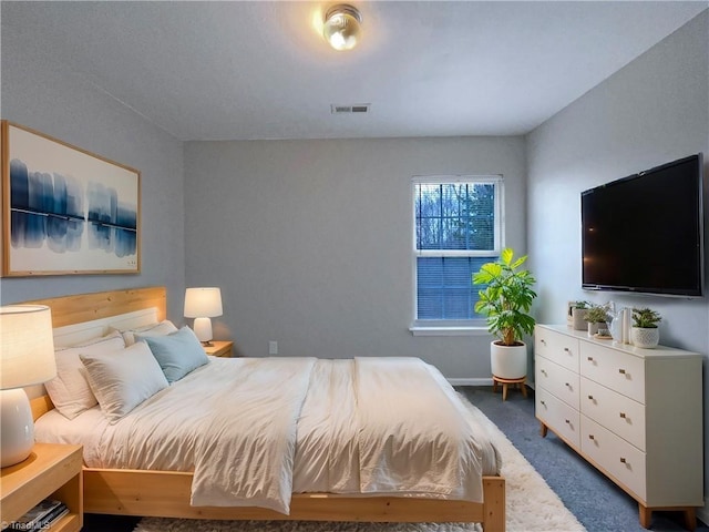 carpeted bedroom with visible vents