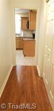 corridor featuring light hardwood / wood-style flooring