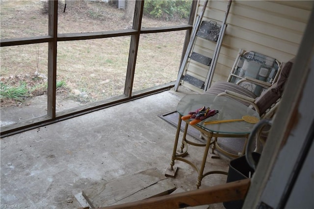 unfurnished sunroom featuring plenty of natural light