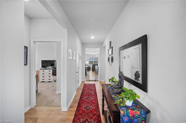 hallway featuring light wood-type flooring