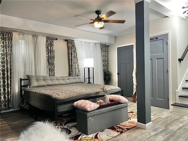 bedroom with hardwood / wood-style flooring and ceiling fan