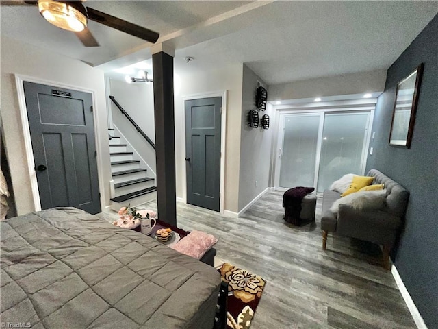 bedroom featuring hardwood / wood-style floors and ceiling fan