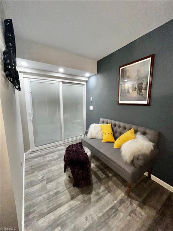 sitting room featuring hardwood / wood-style flooring