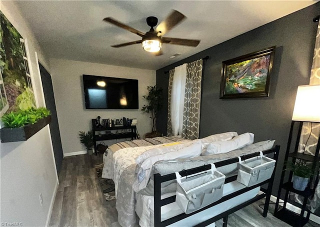 bedroom with wood-type flooring and ceiling fan