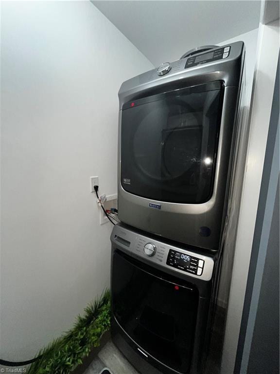 laundry area featuring stacked washer and clothes dryer