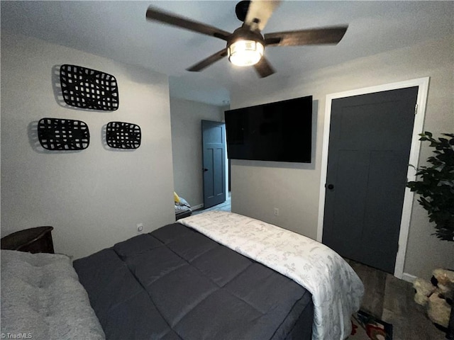 bedroom featuring wood-type flooring, a closet, and ceiling fan