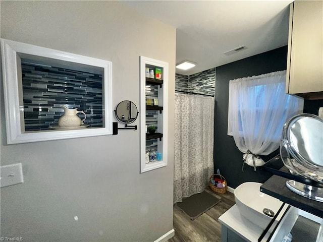 bathroom featuring vanity and hardwood / wood-style flooring