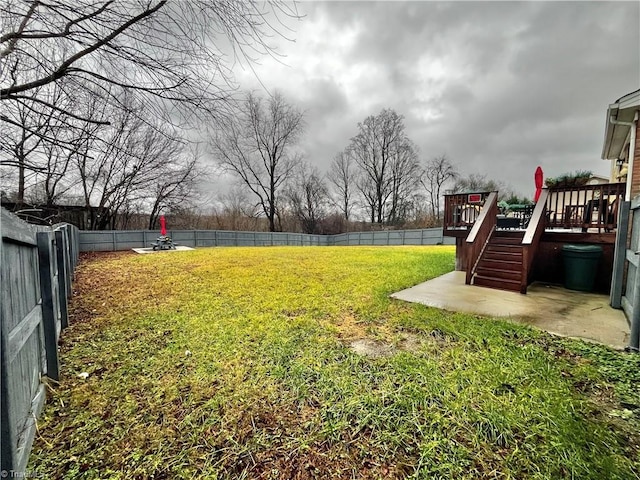 view of yard with a wooden deck