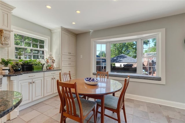 dining space with baseboards, recessed lighting, and a wealth of natural light