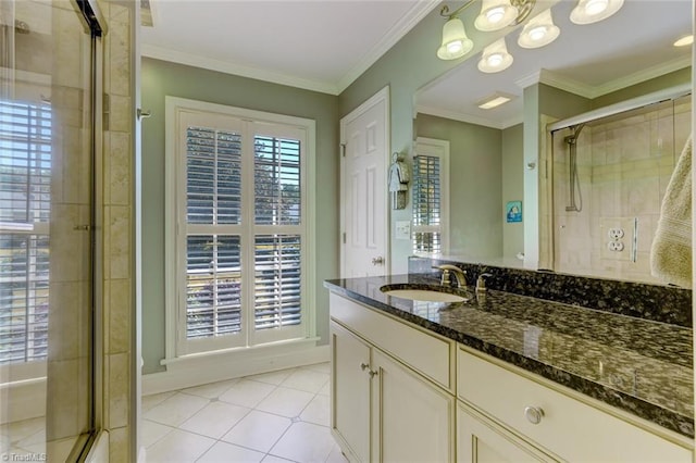 bathroom with vanity, ornamental molding, tile patterned flooring, and a shower stall