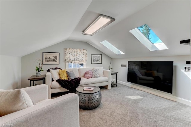 living room featuring vaulted ceiling with skylight, carpet floors, baseboards, and visible vents