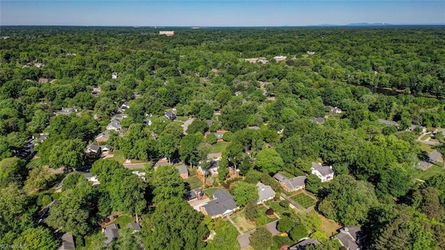 drone / aerial view featuring a view of trees