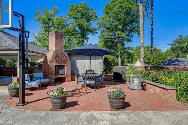 view of patio featuring an outdoor brick fireplace