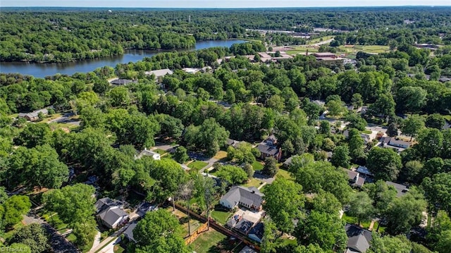 bird's eye view with a view of trees and a water view