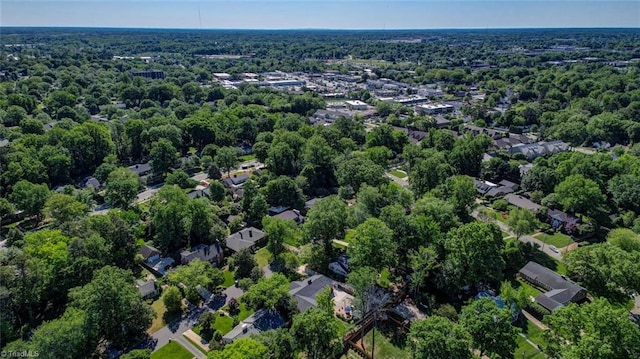 drone / aerial view featuring a view of trees