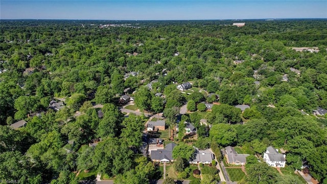 drone / aerial view featuring a forest view