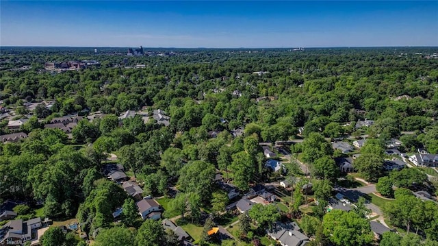 aerial view with a residential view and a view of trees