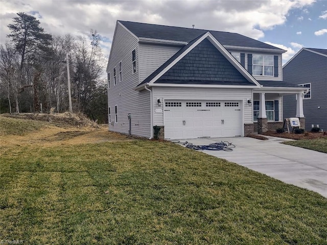 craftsman-style house with driveway, a front lawn, and brick siding