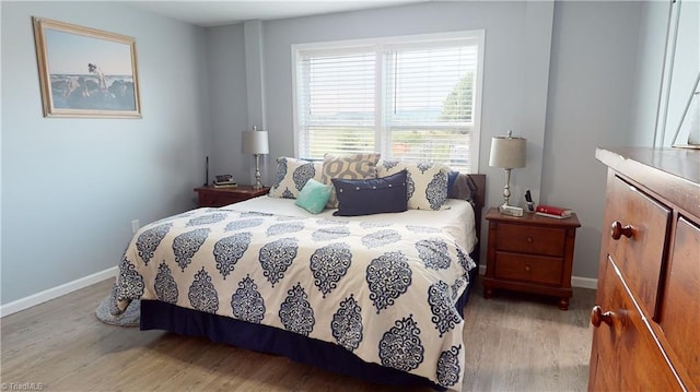 bedroom with hardwood / wood-style flooring