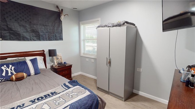 bedroom with light wood-type flooring