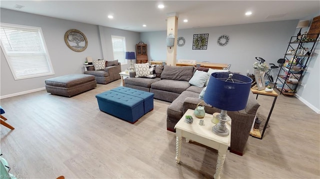 living room with a healthy amount of sunlight and light wood-type flooring