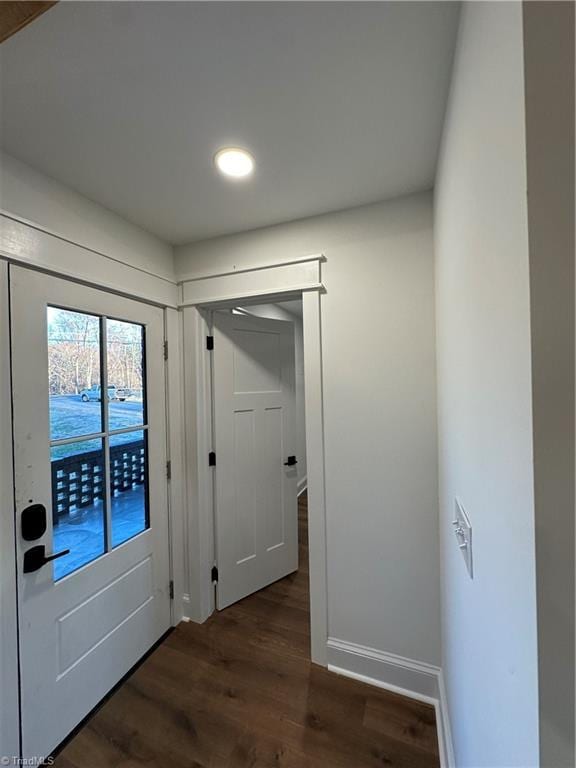 doorway to outside with baseboards, wood finished floors, and recessed lighting