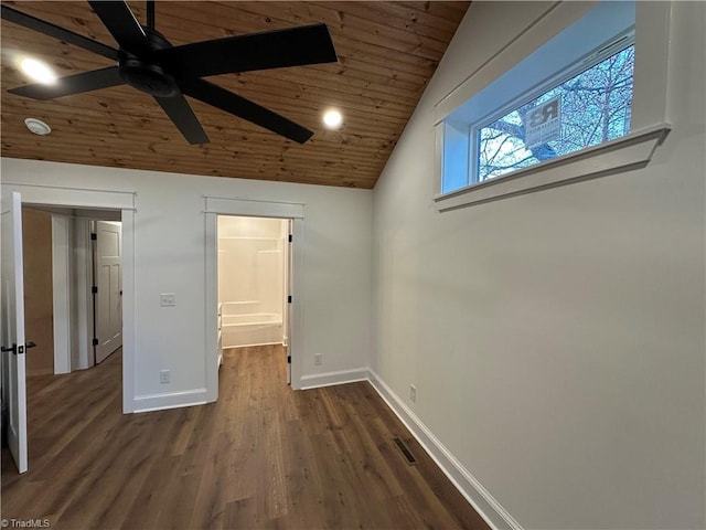 unfurnished bedroom featuring dark wood-style floors, visible vents, vaulted ceiling, wooden ceiling, and baseboards