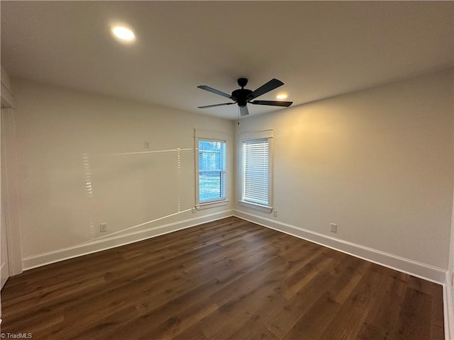 unfurnished room featuring a ceiling fan, recessed lighting, dark wood finished floors, and baseboards