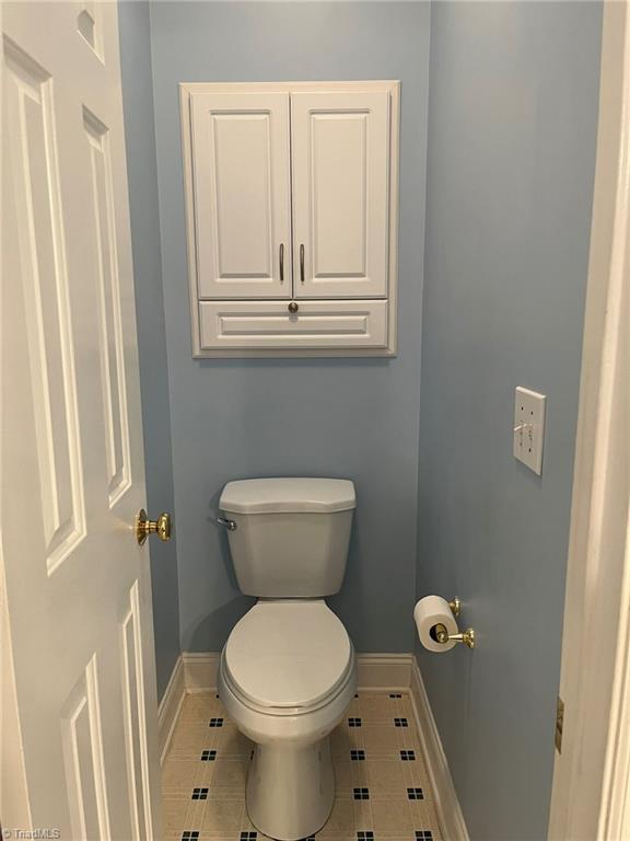 bathroom featuring tile patterned floors and toilet